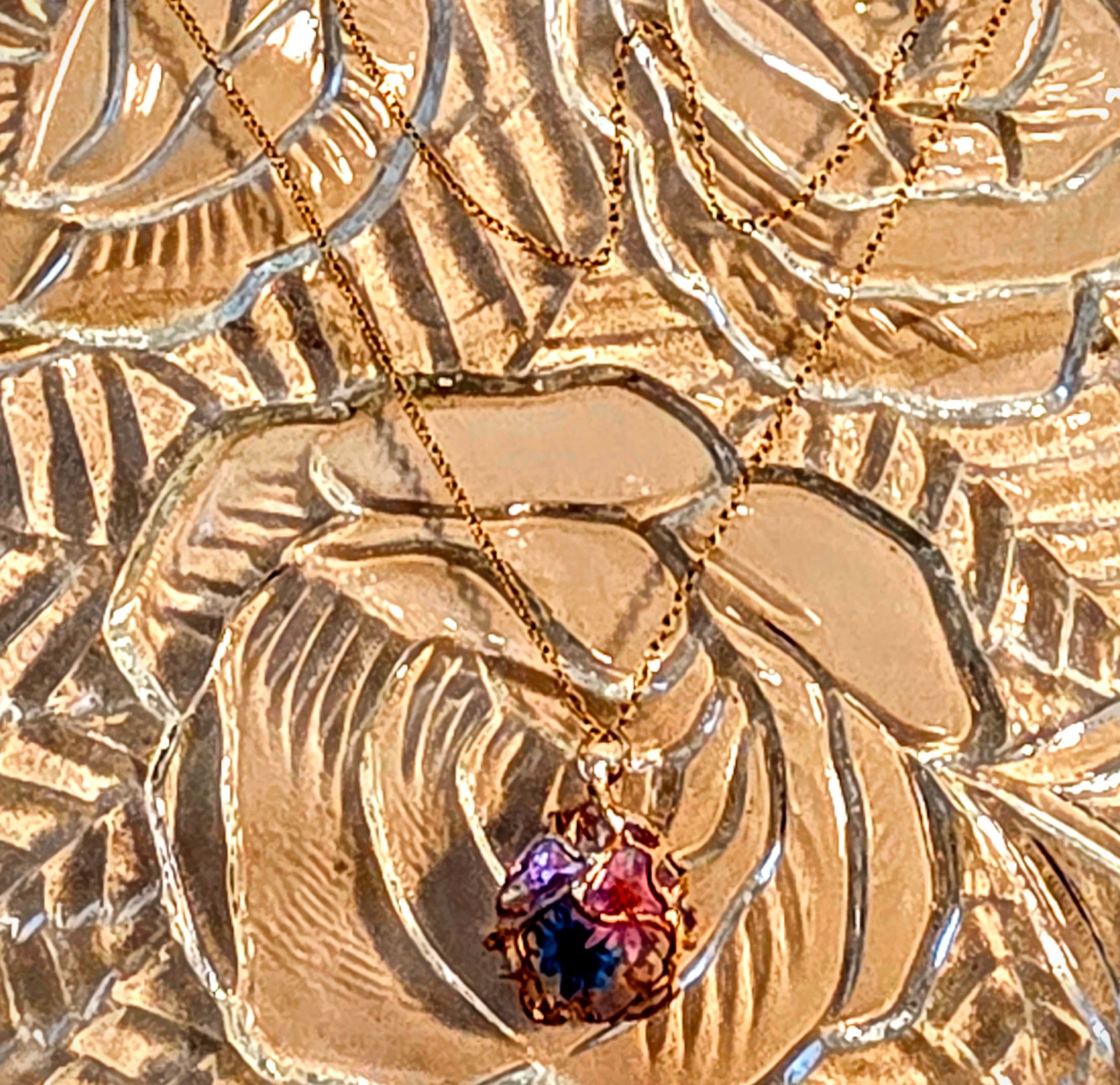 Lovely Necklace with Tiny Dried,Resined, Flowers Encased in a Golden Web. Tarnish Resistant