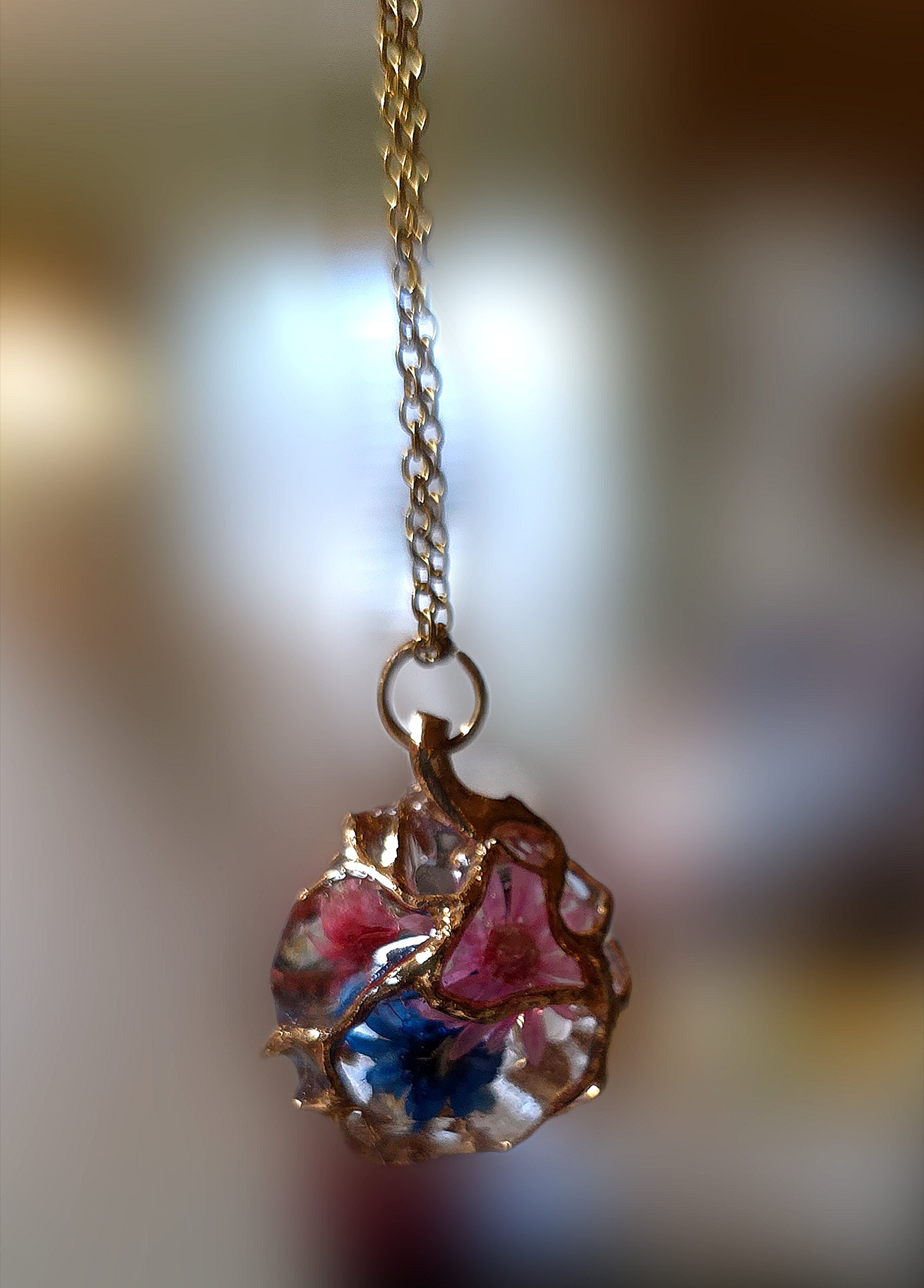 Lovely Necklace with Tiny Dried,Resined, Flowers Encased in a Golden Web. Tarnish Resistant